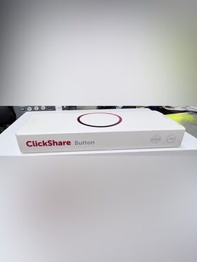 Barco Clickshare botton USB type for wireless conferencing.